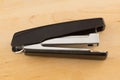 Stapler for stapling papers on a table Royalty Free Stock Photo