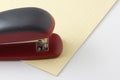 Stapler for stapling papers on a table Royalty Free Stock Photo