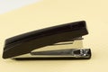 Stapler for stapling papers on a table Royalty Free Stock Photo