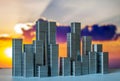 Staples arranged to form city skyline on a sunset background Royalty Free Stock Photo