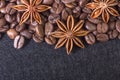 Star anise, on the background of coffee with beautiful highlights on the surface of grains Royalty Free Stock Photo