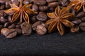 Star anise, on the background of coffee with beautiful highlights on the surface of grains Royalty Free Stock Photo