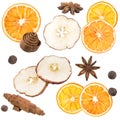 Star anise, black pepper, cinnamon, dried oranges and an apple on a white background.