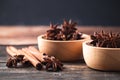 Star anise and cinnamon stick on wooden background Royalty Free Stock Photo