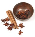 Star anise,cinnamon stick and a bowl Royalty Free Stock Photo