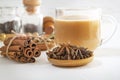 Star anise, cinnamon sticks, cardamom, bay leaf, pepper and other ingredients for making masala tea on a white table Royalty Free Stock Photo