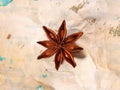 Star anise on crumpled paper Royalty Free Stock Photo