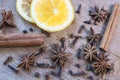 Star anise, orange frut slices, cinnamon and cloves on wooden table. Royalty Free Stock Photo