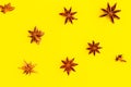 Star anise pattern on bright yellow background Royalty Free Stock Photo