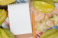 Star apple or averrhoa carambola and notebook on wooden block.