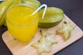 Star apple juice or averrhoa carambola squash on wooden block. Royalty Free Stock Photo