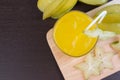 Star apple juice or averrhoa carambola squash on wooden block. Royalty Free Stock Photo