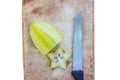 Star apple on wood cutting board and knite isolated