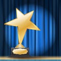 Star award on blue curtain background