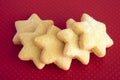 Star biscuits on red background