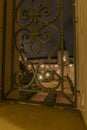 Star bursts across courtyard through ornate wrought iron gate Royalty Free Stock Photo