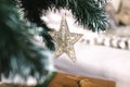 A star on a Christmas tree. New Year decoration. A Christmas decorative - star on the top of A Christmas tree with a beautiful bok Royalty Free Stock Photo