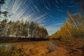 Star and Cloud Trails Over Lake Royalty Free Stock Photo