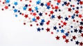 Star confetti in the colors of the United States of America flag on a white background. Royalty Free Stock Photo