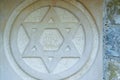 The Star of David engraved in the marble - traditional symbol of modern Jewish