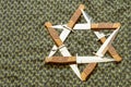 Star of David, hexagram in the form of six daggers on the background of green keffiyeh Royalty Free Stock Photo