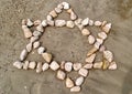 Star of David made of stones on sand Royalty Free Stock Photo