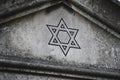 Star of David on a tombstone in a Jewish cemetery Royalty Free Stock Photo