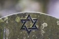 Star of David on a tombstone in a Jewish cemetery Royalty Free Stock Photo