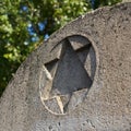 Star of David on the upper part of a gravestone in a Jewish cemetery Royalty Free Stock Photo