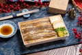 Star eel fish bowl with chopsticks isolated on mat side view on wooden table taiwan food Royalty Free Stock Photo