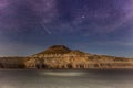 A star falls. The Ustyurt Plateau. District of Boszhir. The bottom of a dry ocean Tethys. Rocky remnants. Kazakhstan. long shutter