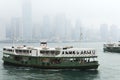 Star Ferry arrives to Kowloon pier in Hong Kong, China. Royalty Free Stock Photo