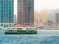 Star Ferry boat crosses the Victoria Harbour, Hong Kong Royalty Free Stock Photo