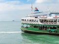 Star Ferry boat crosses the Victoria Harbour, Hong Kong Royalty Free Stock Photo