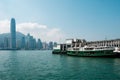 Star Ferry boat on Tsim Sha Tsui Star Ferry Pier and HongKong Island skyline background