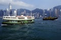 Star Ferry in Hong Kong Harbor with skyline in background Royalty Free Stock Photo