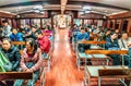 The Star Ferry passengers transported across Victoria Harbour in Hong Kong. People inside sail boat Royalty Free Stock Photo