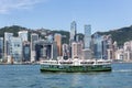 Star Ferry in Victoria Harbour with Hong Kong skyline in background. Royalty Free Stock Photo