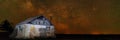 A star filled night sky with farm house in the foreground Royalty Free Stock Photo