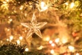 Star of glass with abstract background of holiday lights Royalty Free Stock Photo