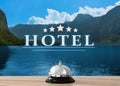 5 Star hotel. Reception desk with service bell and landscape on background Royalty Free Stock Photo