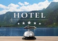 5 Star hotel. Reception desk with service bell and landscape on background Royalty Free Stock Photo