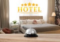 5 Star hotel. Reception desk with service bell and view of bedroom on background Royalty Free Stock Photo