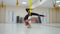 Star Inversion aerial antigravity yoga pose, woman exerciseses with hammock