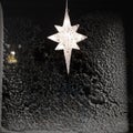 Star for lightning in the window and decoration during the winter time Royalty Free Stock Photo