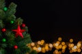 The star ornaments decorate on Christmas tree with bokeh lights background. Royalty Free Stock Photo