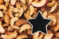 Star, pointer, price, tag, lies on dried apple Royalty Free Stock Photo