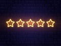 Star rating neon banner. Golden five stars on brick wall. Night bright advertising. Shining signboard. Vector Royalty Free Stock Photo