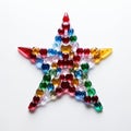 Star shape made of multicolored glass beads on a white background