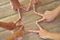 Star shape with six hand fingers on a beach